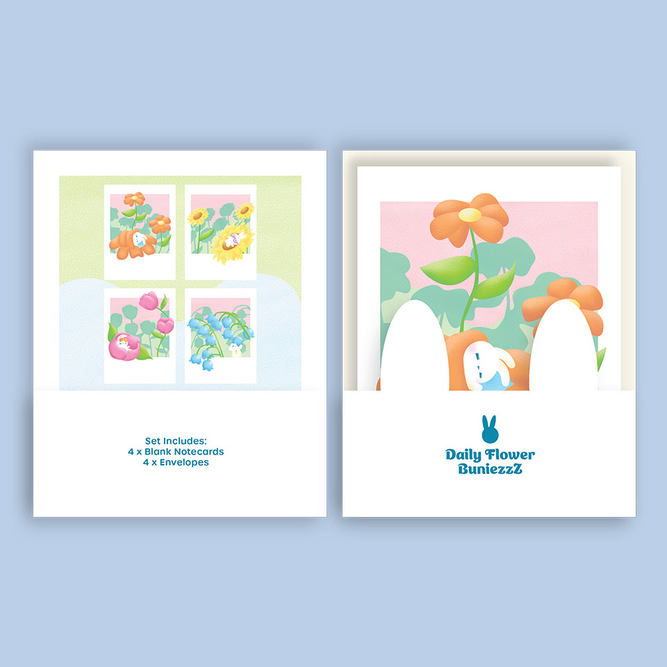 Image of a greeting card set with bunnies on flowers.